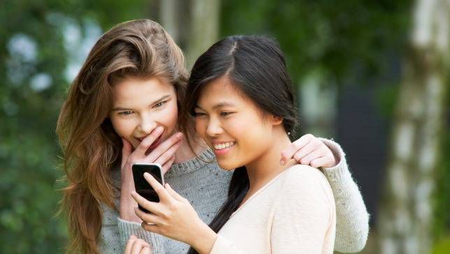 Two women reading a text