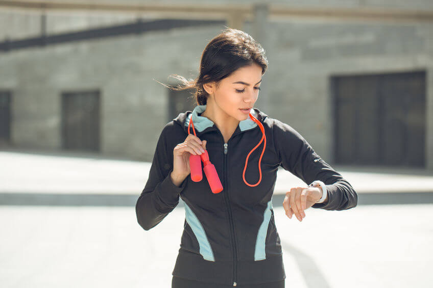 Young-active-woman-wearing-fitness-watch